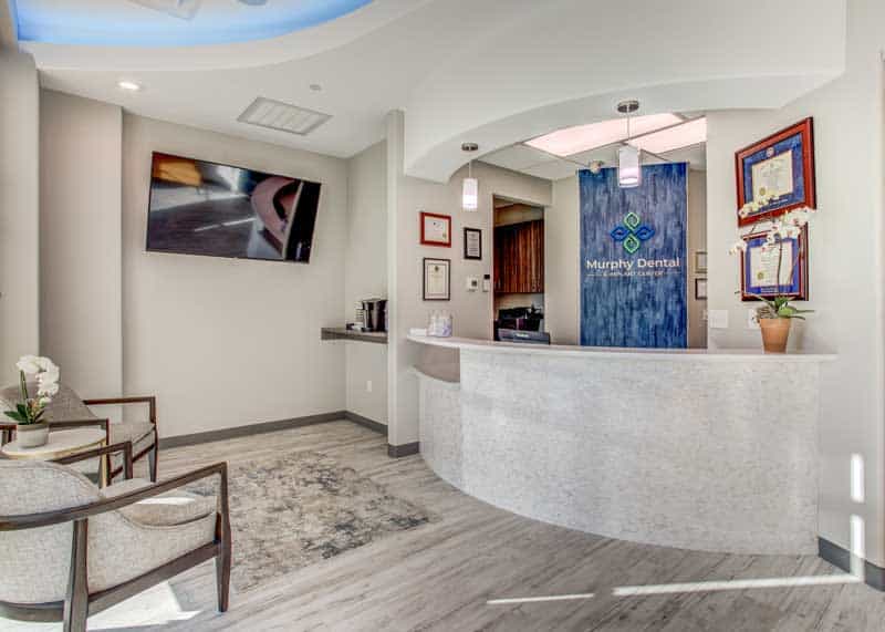Modern dental office reception area in Murphy TX with comfortable seating, bright decor, and friendly atmosphere.